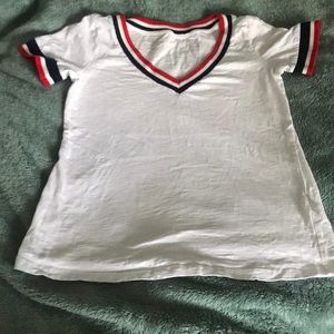 White t-shirt with red, white, and blue stripes.